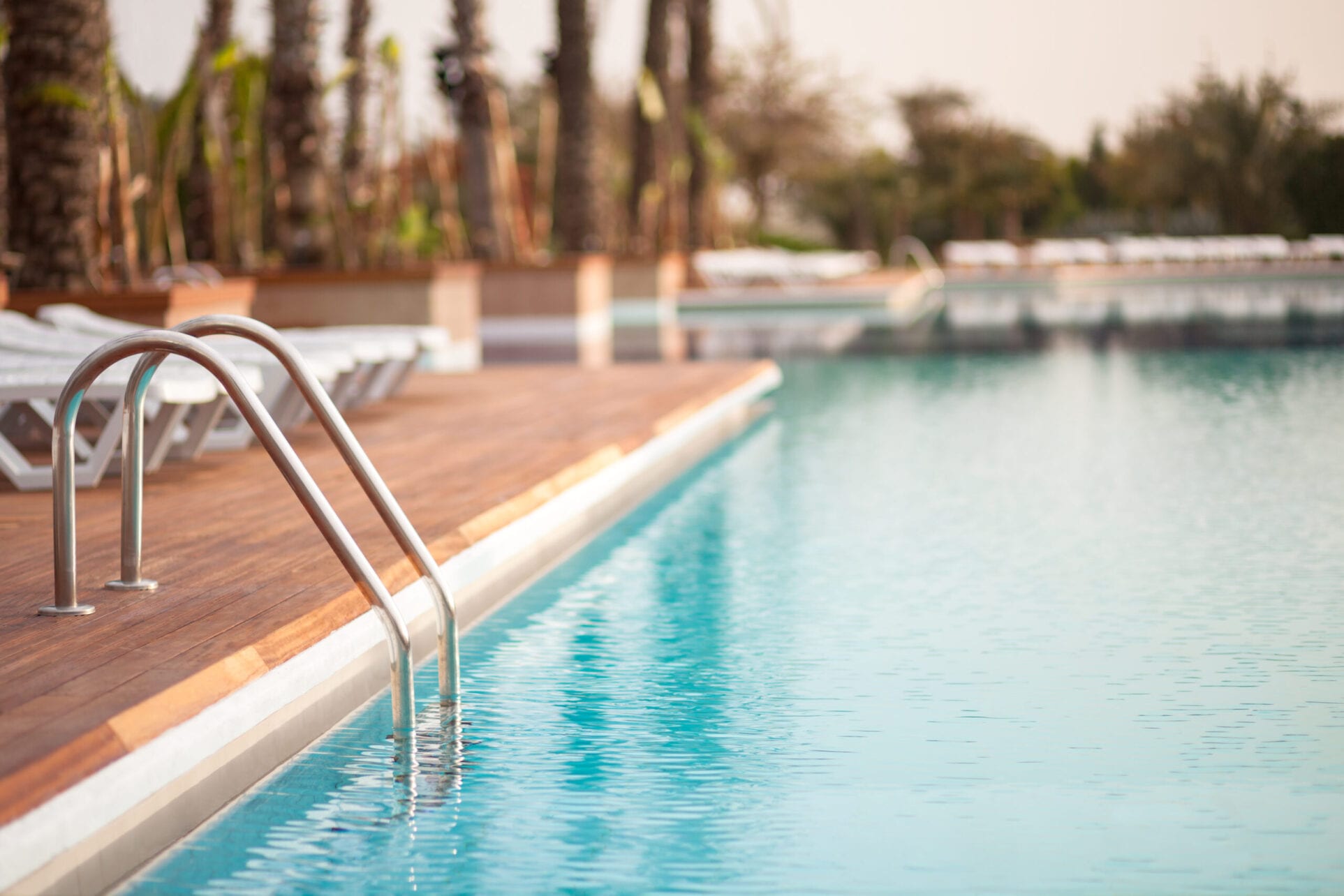Empty,Water,Pool,With,Turquoise,Water,,Focus,On,Metal,Hand apartments with pools near downtown Indianapolis Indiana